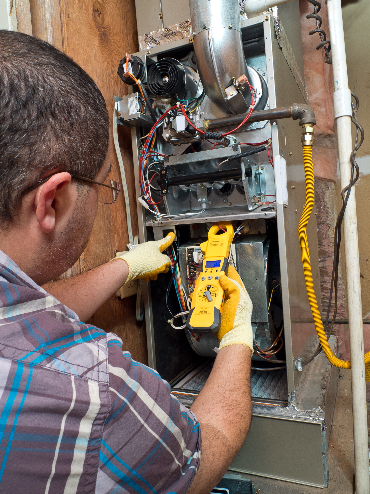 Repairing an old furnace in basement of home in Ballwin Missouri